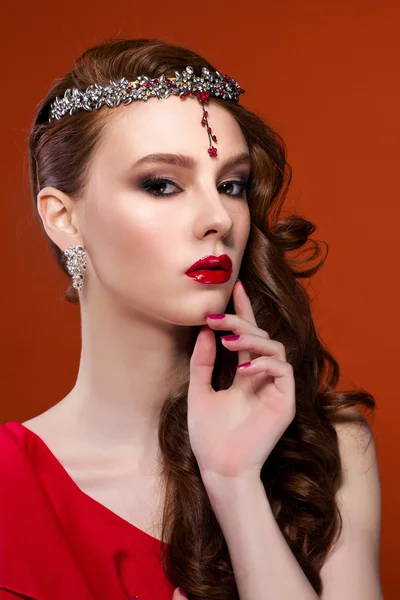 Beauty woman in red dress, red background. Red lips and nails. — Stock Photo, Image