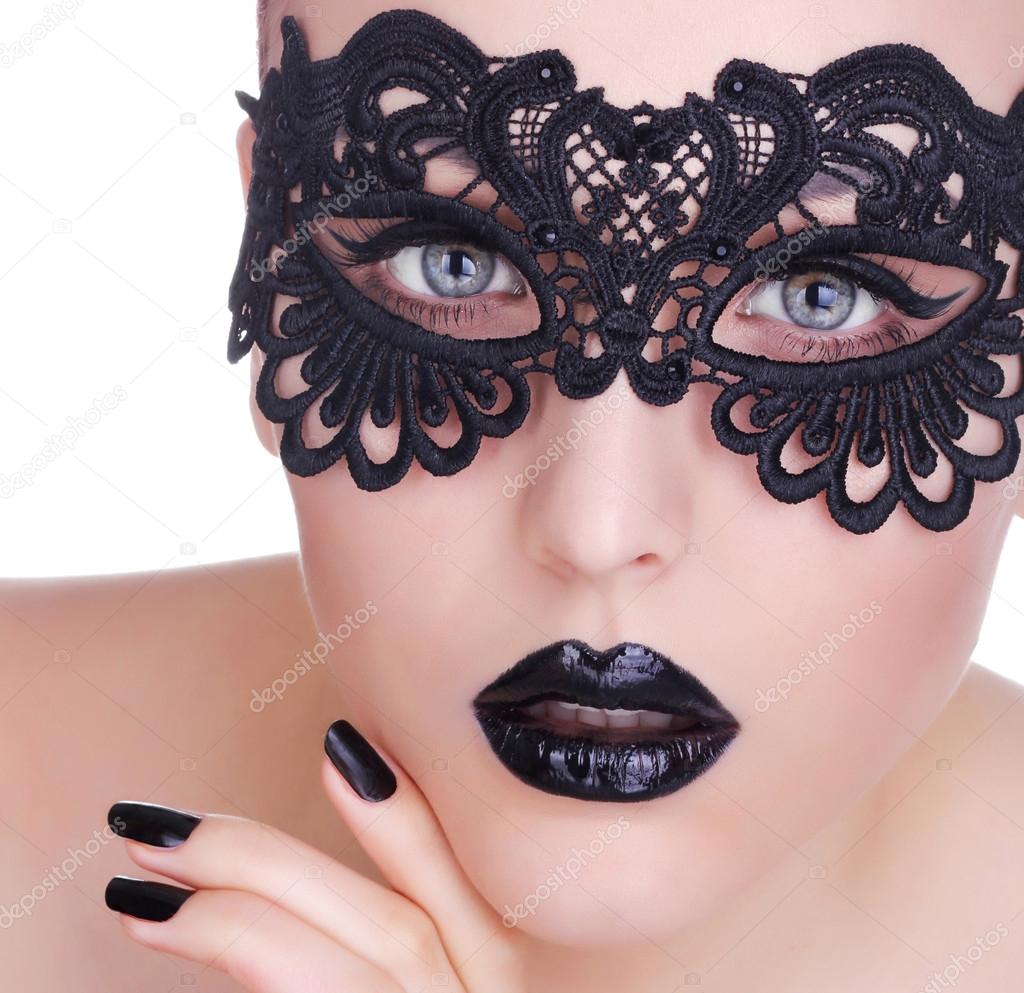 Beautiful Woman with Black Lace mask over her Eyes.  Black Manic