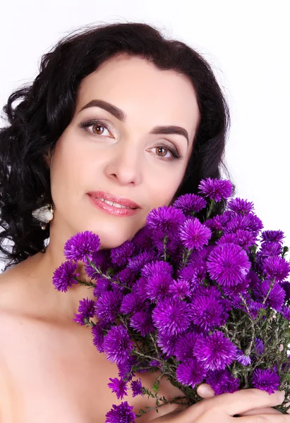 Portrait of beautiful middle aged woman holding a bouquet of wil — Stock Photo, Image