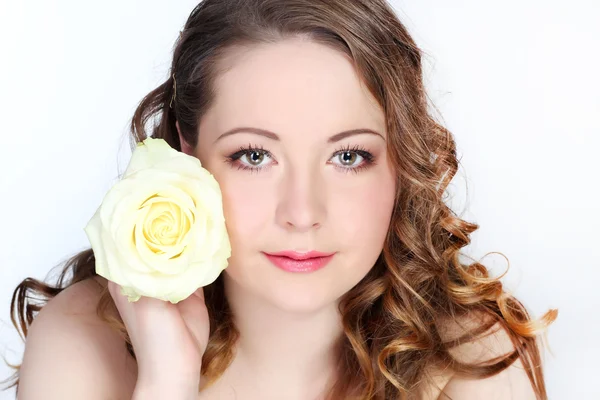 Beautiful young woman with pink rose Royalty Free Stock Photos