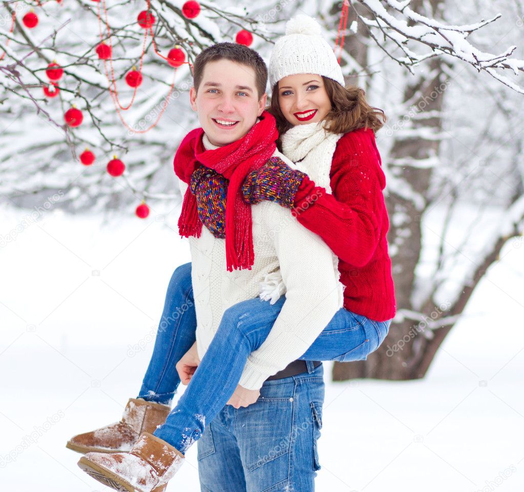 Happy romantic couple in winter forest, Christmas mood, happy new year