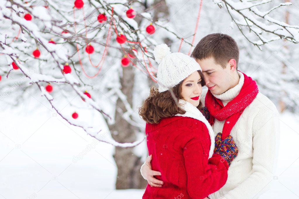 Happy romantic couple in winter forest, Christmas mood, happy ne