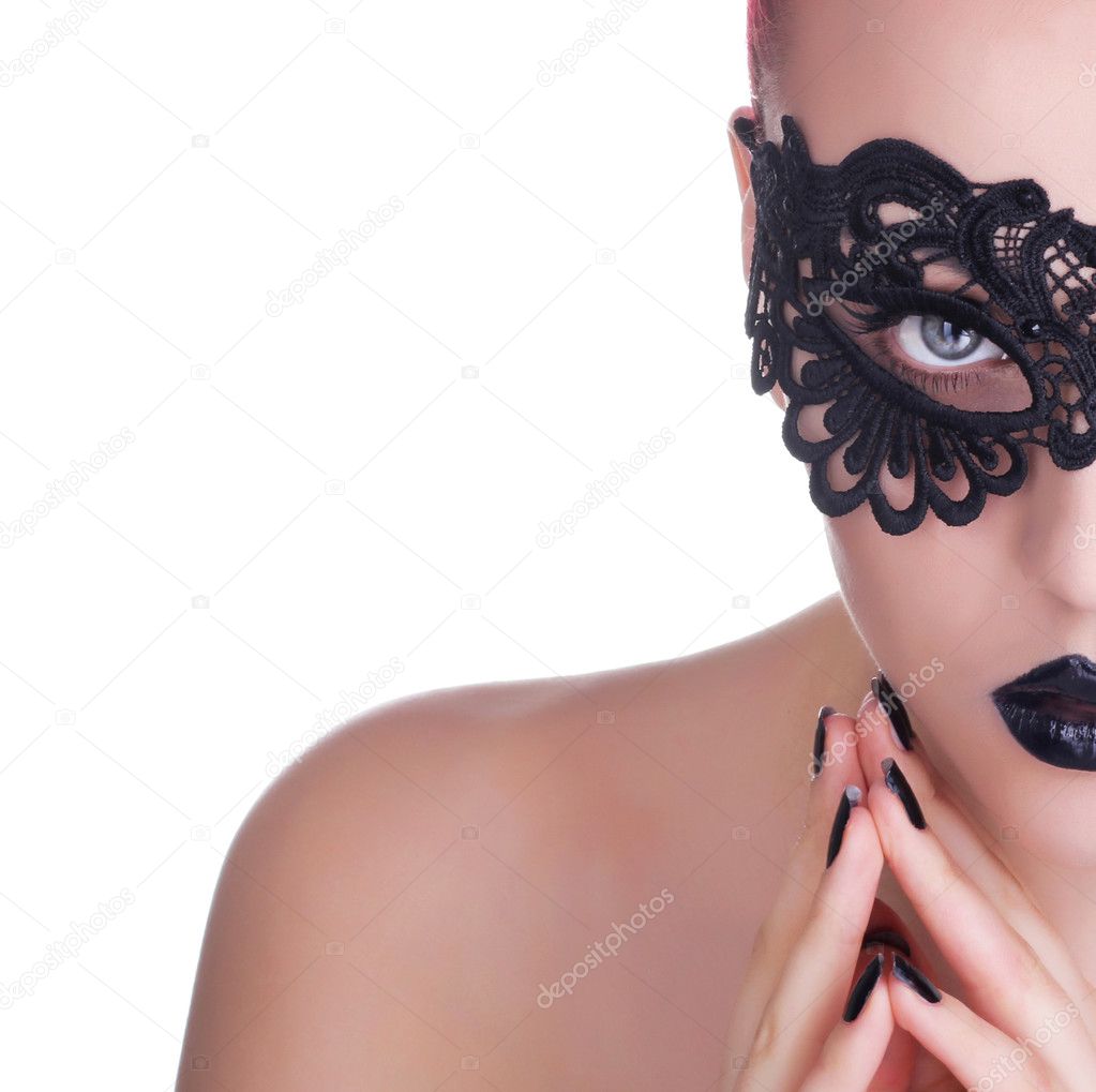 Beautiful Woman with Black Lace mask over her Eyes.  Black Manicure and Lipstick. Manicure and Makeup. Make up concept. Passion