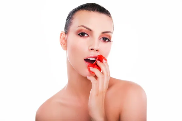 Portrait of young beautiful woman with red flower over white bac — Stock Photo, Image