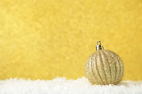 Christmas silver ball on gold glitter background. Top view