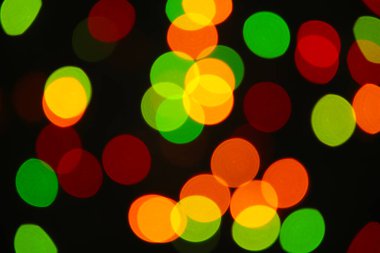 Noel ışığı arka planı. Parlak tatil arkaplanı. Yanıp sönen Yıldızlarla Odaklanmış Arkaplan. Üst görünüm.