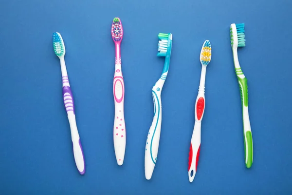 Toothbrushes Dark Blue Background Top View — Stock Photo, Image
