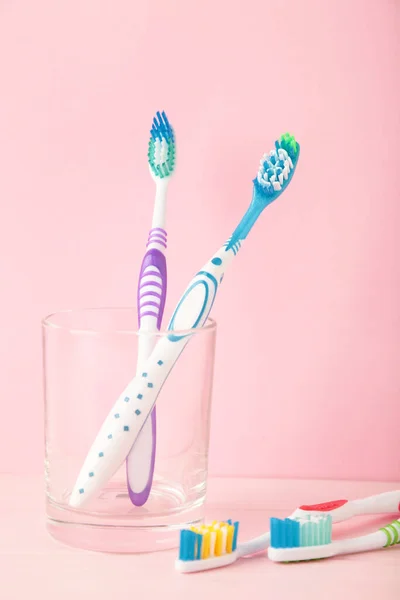 Toothbrushes Glass Pink Background Tools Oral Care Top View — Stock Photo, Image