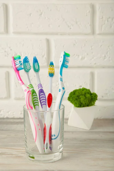 Toothbrushes Glass White Background Tools Oral Care Top View — Stock Photo, Image