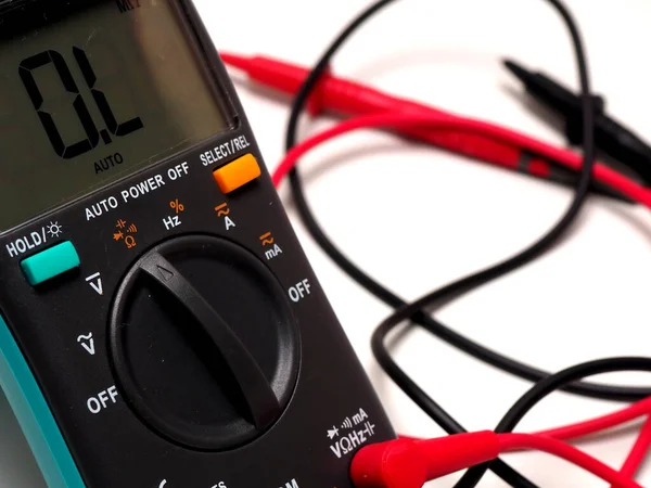 Picture of a digital multimeter, with red and black probe. Shoot on a white isolated background