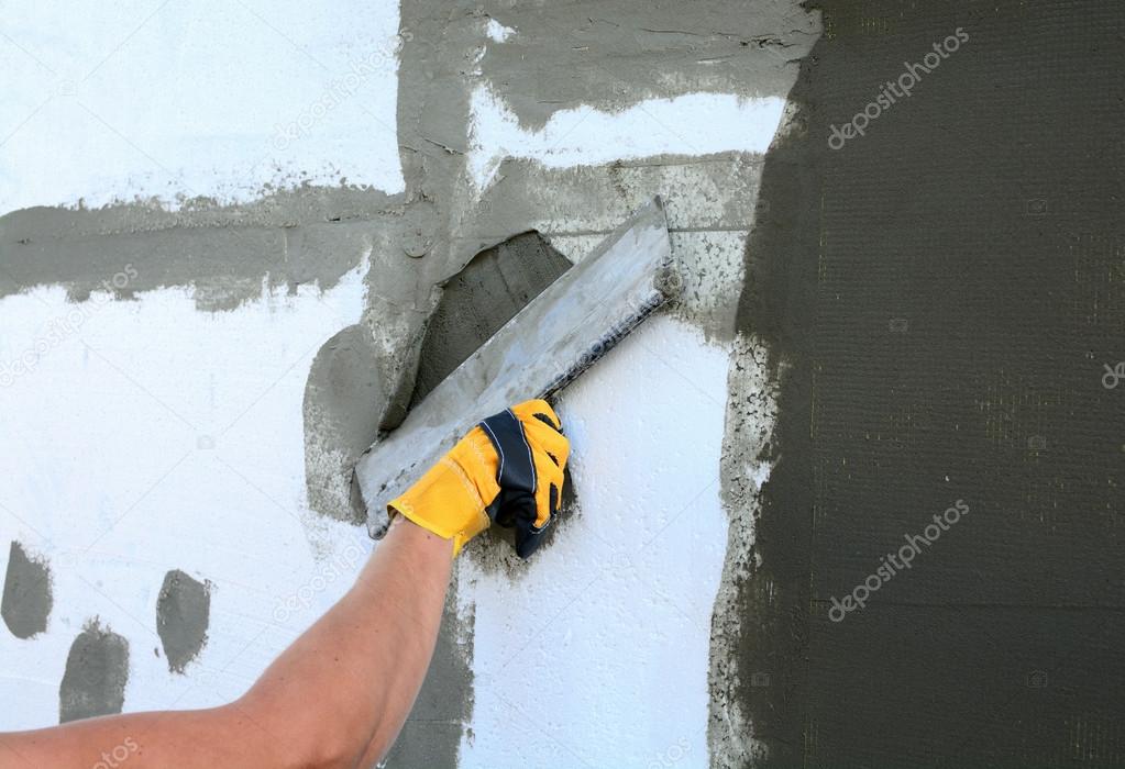 Worker spreading mortar