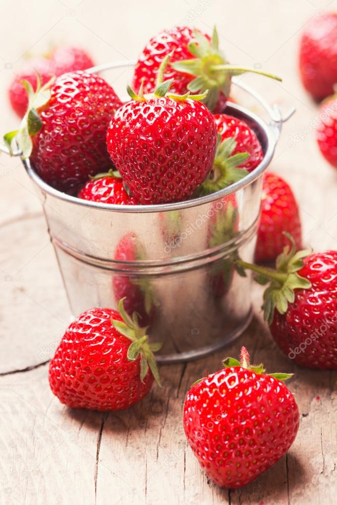 Strawberries in a decorative bucket