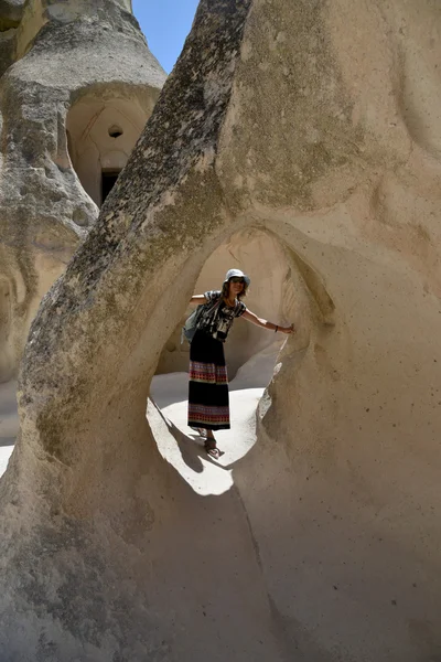 Woman in rock tunnel — Stock Photo, Image