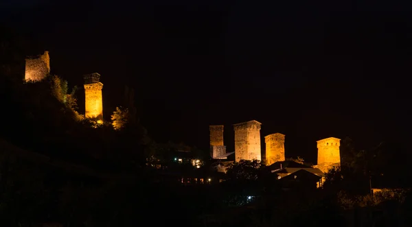 Old illuminated towers - Mestia — Stock Photo, Image