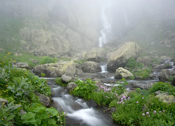 Stream and waterfall in mist — Stock Photo, Image