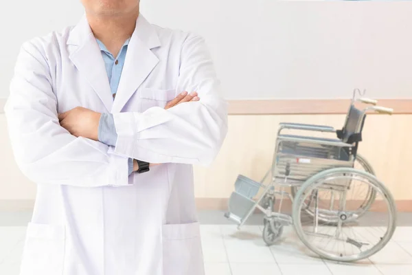 Medicine doctor and Patients come to the hospital and blurred background of wheelchair , Healthcare and medical concept.