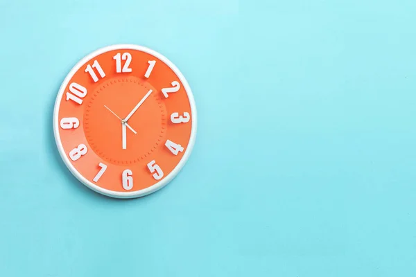 Beautiful Orange Wall Clock Blue Background Concept Start Morning Work — ストック写真