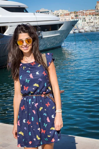 Portrait of Beautiful Happy Woman on a Sea Port Background in France