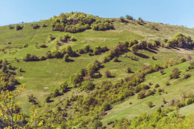 Beautiful Summer Mountain Landscape with Green Meadows and Hills .Babintsi Village in Teteven,Bulgaria