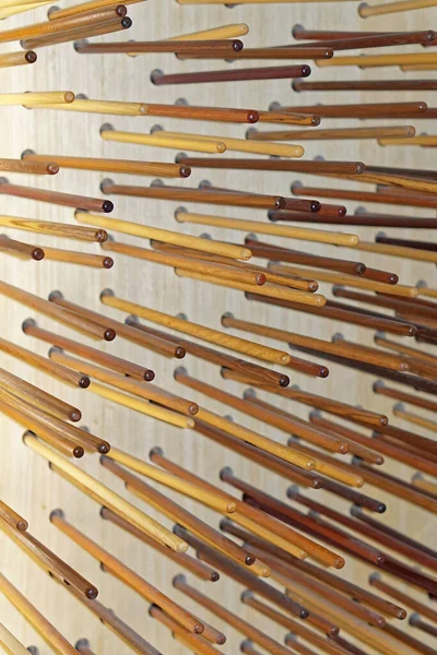 Many Long Wooden Sticks Wall Decor — Stock Photo, Image