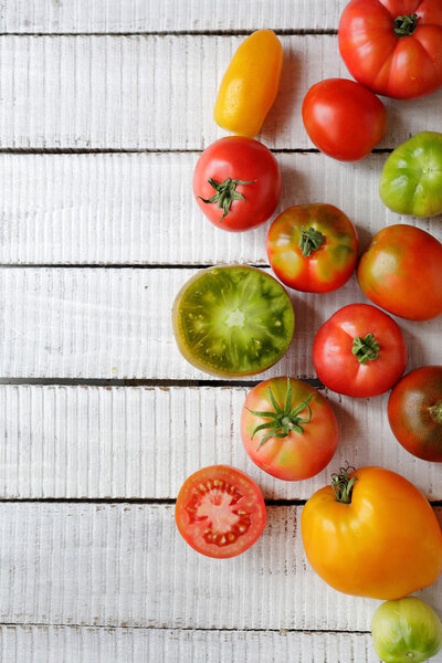 fresh tomatoes on white boards