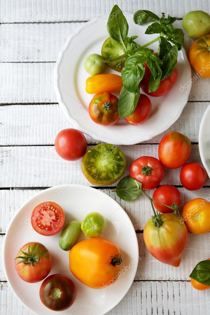 fresh organic tomatoes on boards