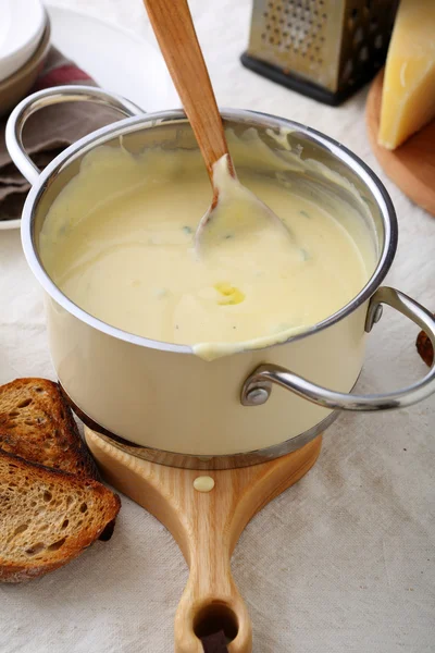 Hot cream soup in saucepan — Stock Photo, Image