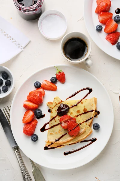 Coffee cup and crepes — Stock Photo, Image