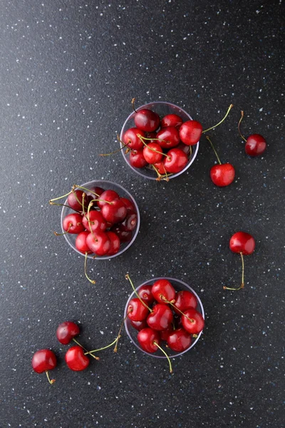 Cherries in bowl on dark background — Stock Photo, Image
