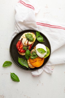 Toast with cheese and pesto top view