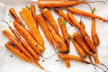Top view of  roasted carrots  on baking dish