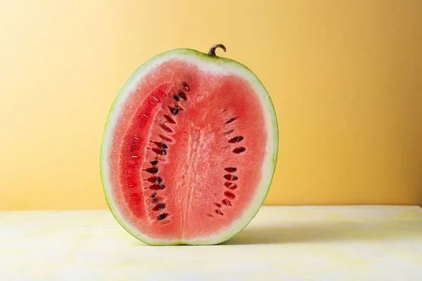 Half Ripe Organic Watermelon Golden Background Copy Space — Stock Photo, Image