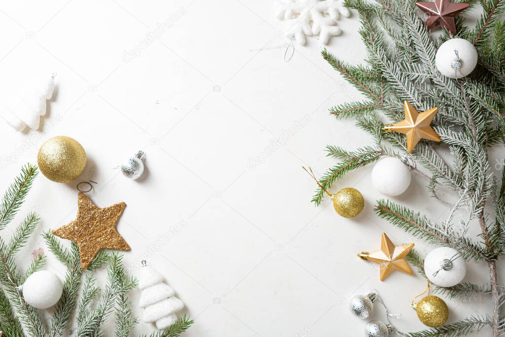 Festive decorations,fir branches, baubles on light background. Flat lay. Top view, copy space.