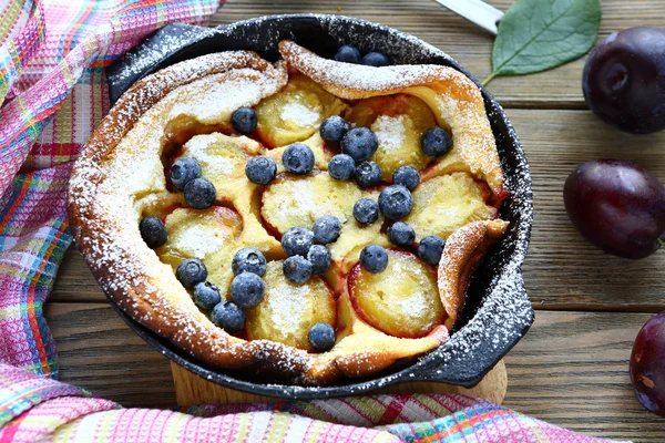 Plum Clafoutis with blueberries — Stock Photo, Image