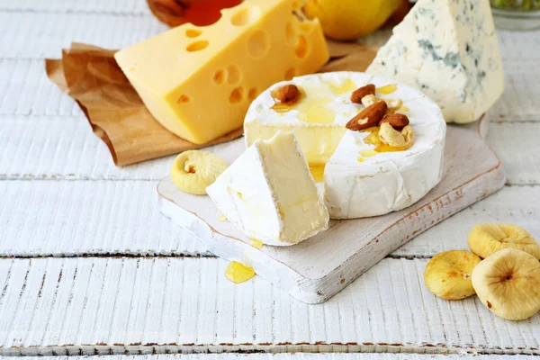 Assortment cheese and dried fruit — Stock Photo, Image