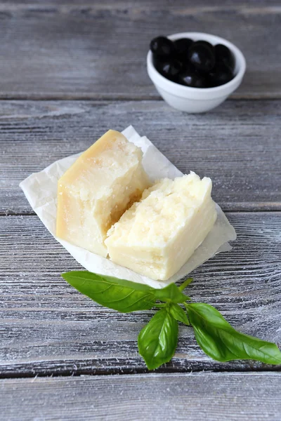 Cheese with basil and olives — Stock Photo, Image