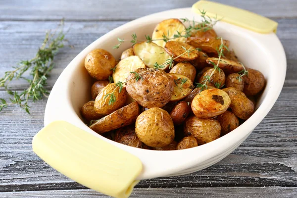 Baked potatoes in a bowl — Stock Photo, Image