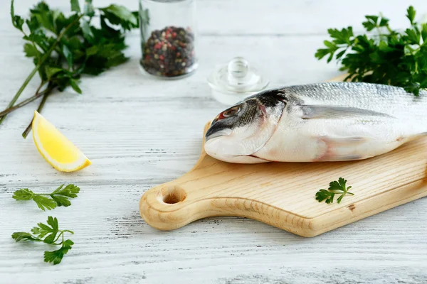 Dorado with parsley and pepper — Stock Photo, Image