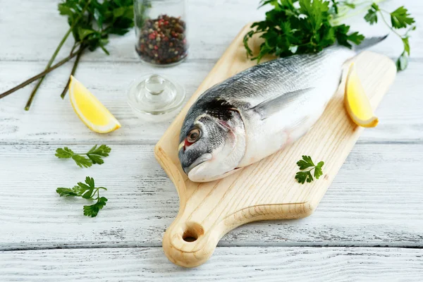 Fresh dorade with parsley and pepper — Stock Photo, Image