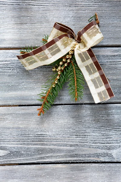 Christmas bow and fir branch — Stock Photo, Image