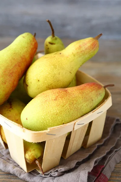 Sweet pears in a wooden box — Stock Photo, Image