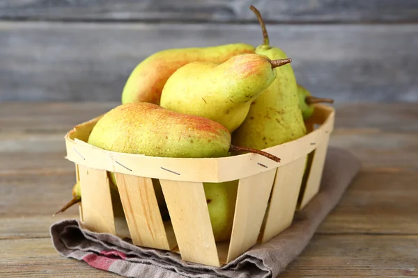 Juicy pears in wooden crate — Stock Photo, Image
