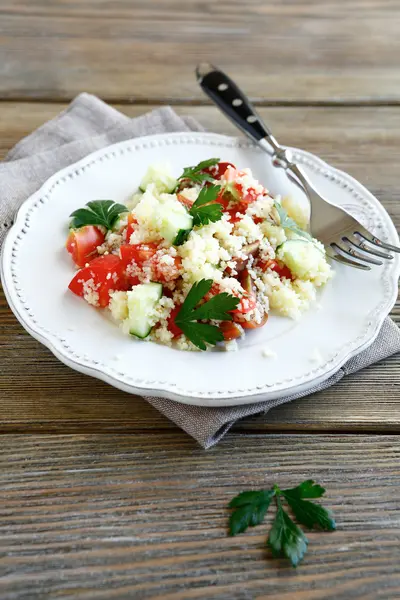 Fresh salad with arabic couscous and vegetables on a plate — Stock Photo, Image