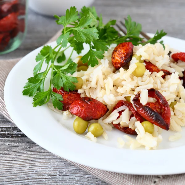 Tasty risotto with sun-dried tomatoes and parsley — Stock Photo, Image