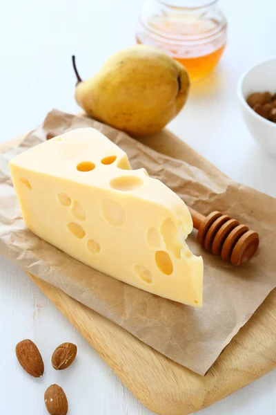 Cheese with almonds and pear — Stock Photo, Image