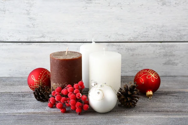 Christmas balls with candles and cones — Stock Photo, Image