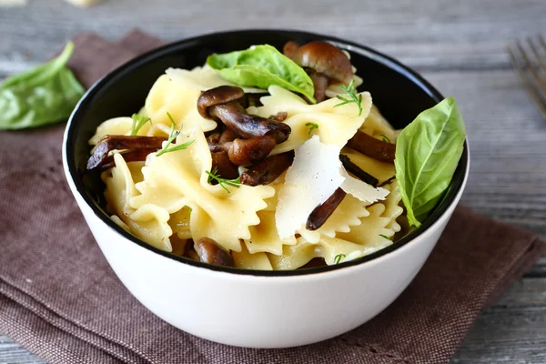 Farfalle pasta with mushrooms and cheese — Stock Photo, Image