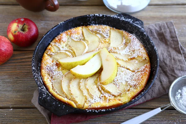 Delicious pie with pears in pan on the boards — Stock Photo, Image