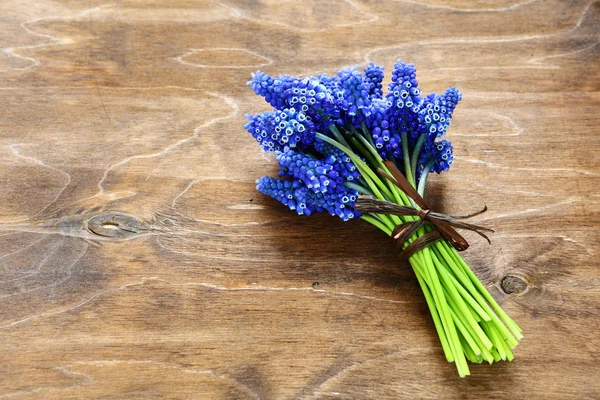 Bouquet of hyacinths on wooden surface — Stock Photo, Image