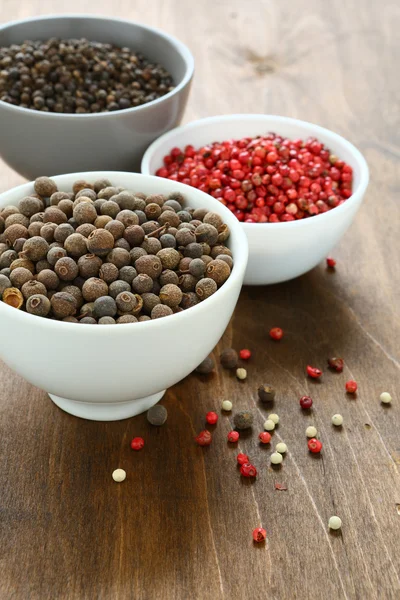 Peppercorns assorted in bowls — Stock Photo, Image